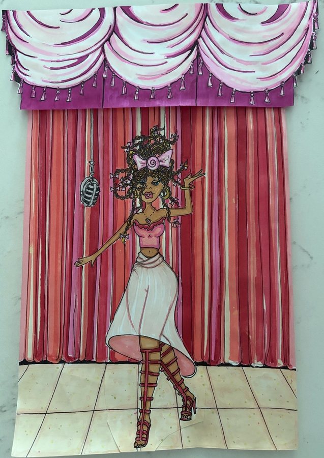 Singer performing on stage in a paper cutout work