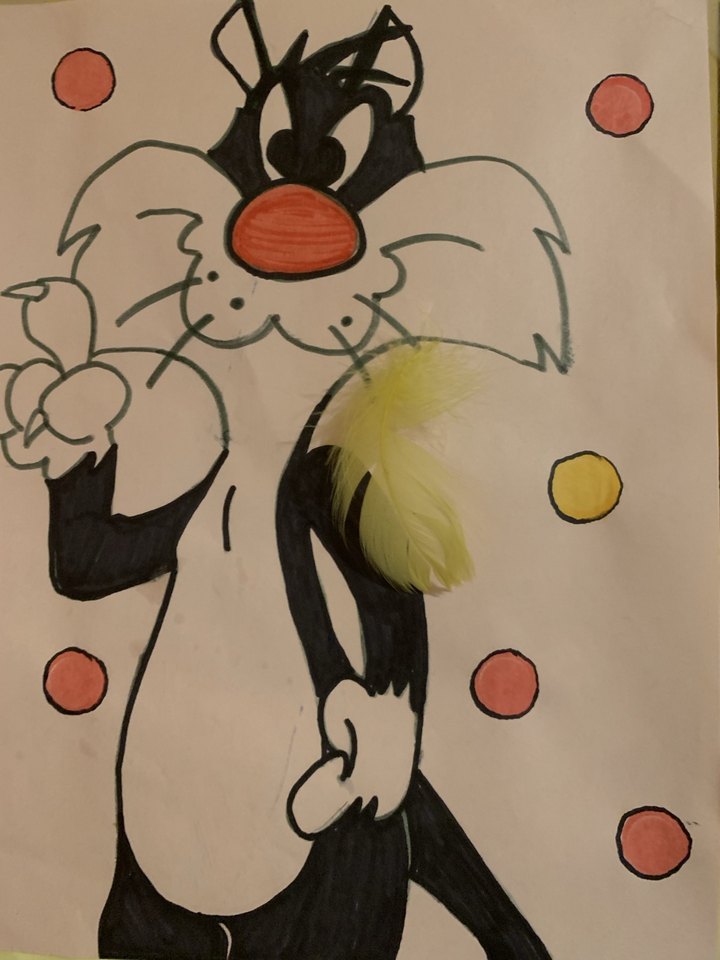 Marker drawing of Sylvester the cat with a yellow feather attached