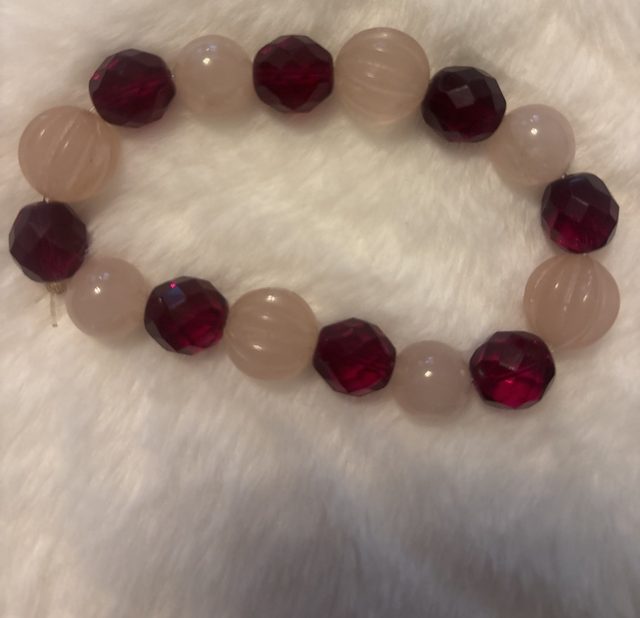 Garnet-toned crystal and carved pink bead bracelet